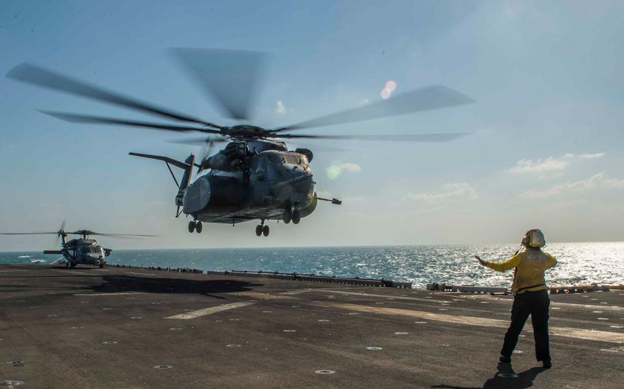 An MH-53E Sea Dragon from Helicopter Mine Countermeasures Squadron 15, lands on the flight deck of the amphibious assault ship USS Boxer on Dec. 21, 2013 in the Arabian Gulf.