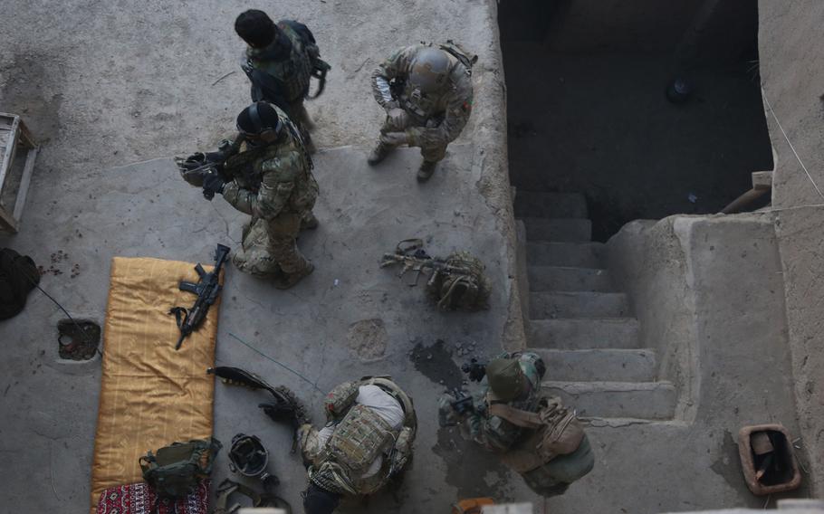 U.S. Special Forces soldiers with the Combined Joint Special Operations Task Force-Afghanistan prepare to patrol with Afghan National Army special forces in Ghorband district, Parwan province, Afghanistan, Jan. 15, 2014.