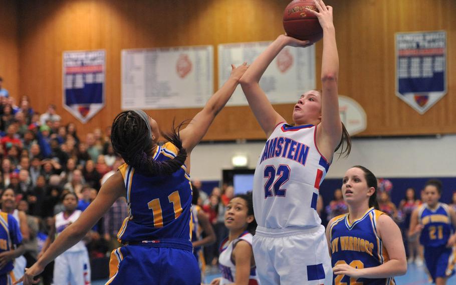 Ramstein's Lindsey Breton takes a shot over Wiesbaden's Cierra Martin in a game at Ramstein, Germany, Saturday, Jan. 25, 2014. The Warriors defeated the Royals 35-33.