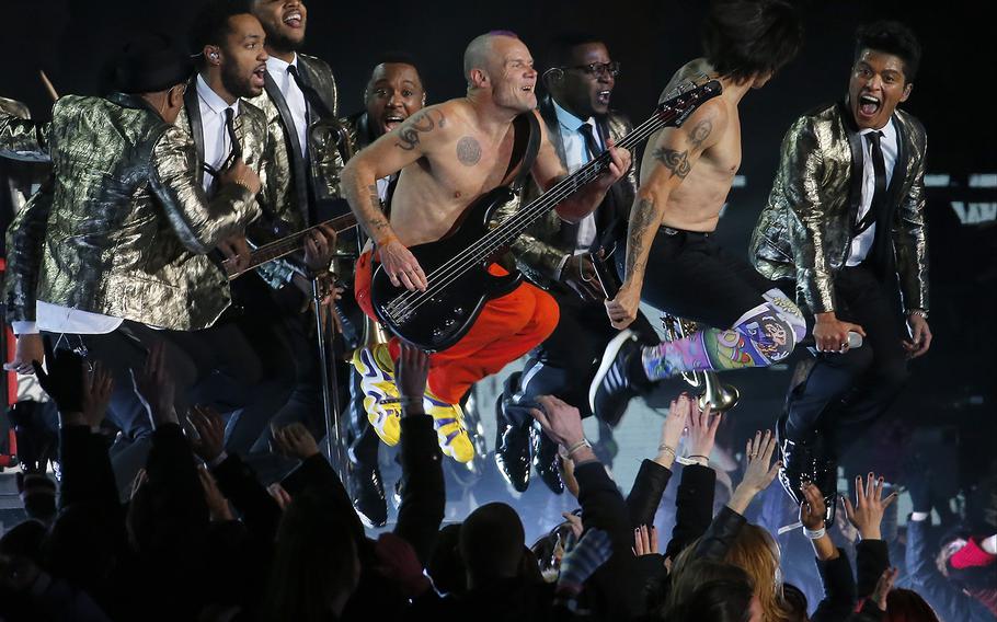 The Red Hot Chili Peppers and Bruno Mars perform during the halftime show of the NFL Super Bowl XLVIII football game between the Seattle Seahawks and the Denver Broncos Sunday, Feb. 2, 2014, in East Rutherford, N.J. (AP Photo/Matt York)