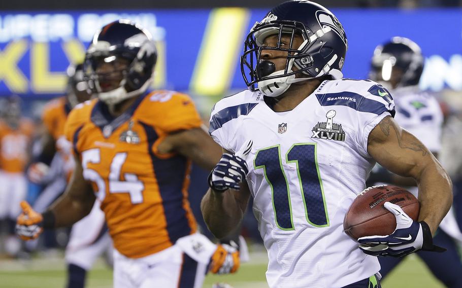Seattle Seahawks' Percy Harvin (11) returns a kickoff 87-yards for a touchdown during the second half of the NFL Super Bowl XLVIII football game against the Denver Broncos Sunday, Feb. 2, 2014, in East Rutherford, N.J. (AP Photo/Matt Slocum)