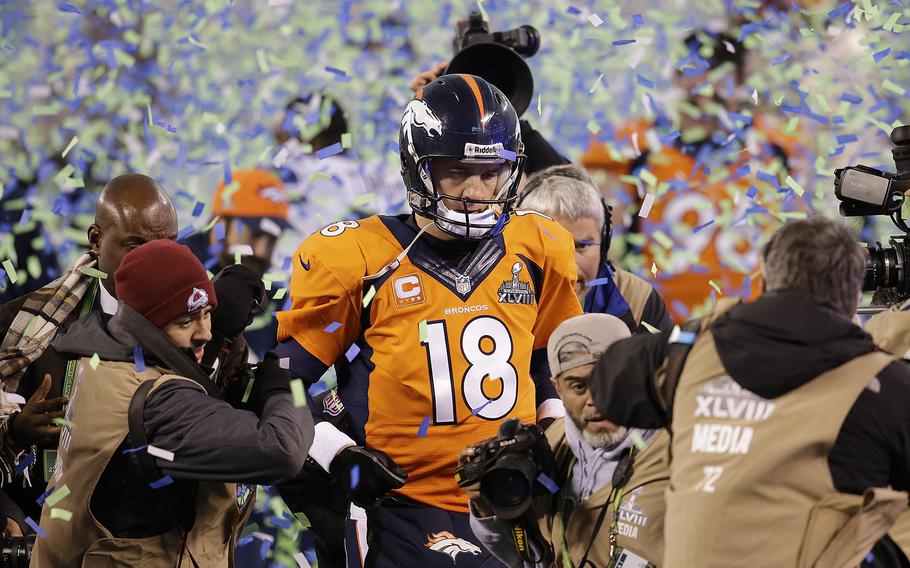 Denver Broncos quarterback Peyton Manning walks off the field after the Broncos lost to the Seattle Seahawks in the NFL Super Bowl XLVIII football game Sunday, Feb. 2, 2014, in East Rutherford, N.J. The Seahawks won 43-8. (AP Photo/Chris O'Meara)