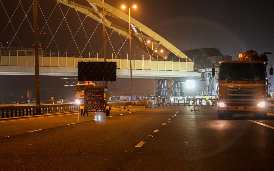 Workers moved an approximately 400-foot long tied-arch suspension flyover bridge across Prince Khalifa Bin Salman Causeway, which connects Juffair to Hidd, on Jan. 31, 2014. The bridge will connect Naval Support Activity Bahrain to the U.S. Navy port facility.