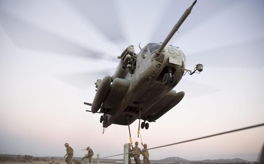 A CH-53 Super Stallion with Marine Medium Tiltrotor Squadron 163 maintains a low altitude for Marines with Combat Logistics Battalion during Helicopter Support Team training at Marine Corps Air Station Miramar, Calif., on Feb. 5, 2014.