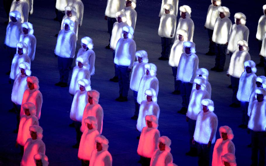 Performers costumed in illuminated red, white and blue outfits form the Russian national flag during the Opening Ceremony for the Winter Olympics at Fisht Olympic Stadium in Sochi, Russia, Friday, Feb. 7, 2014. (Chuck Myers/MCT)