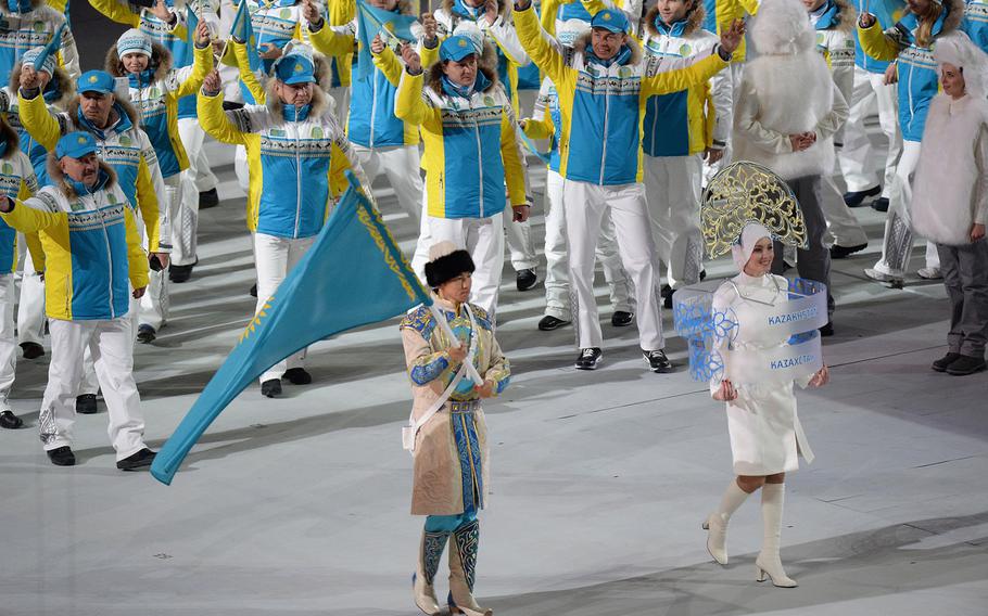 The team from Kazakhstan enters Fisht Olympic Stadium in Sochi, Russia, during the Opening Ceremony for the Winter Olympics, Friday, Feb. 7, 2014. (Chuck Myers/MCT)