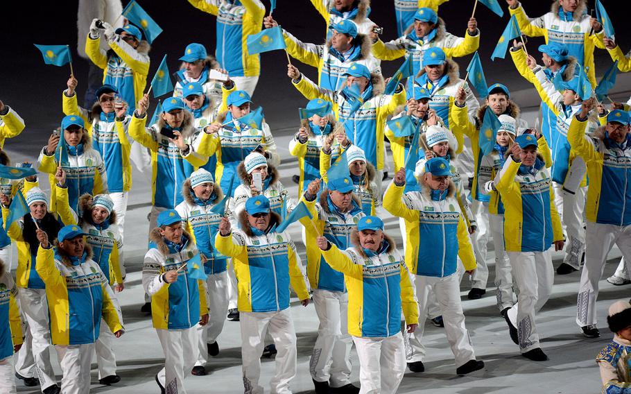 The team from Kazakhstan enters Fisht Olympic Stadium in Sochi, Russia, during the Opening Ceremony for the Winter Olympics, Friday, Feb. 7, 2014. (Chuck Myers/MCT)