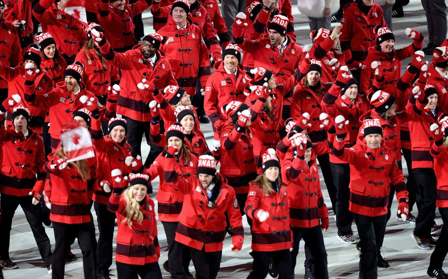 The team from Canada enters Fisht Olympic Stadium in Sochi, Russia, during the Opening Ceremony for the Winter Olympics, Friday, Feb. 7, 2014. (Chuck Myers/MCT)
