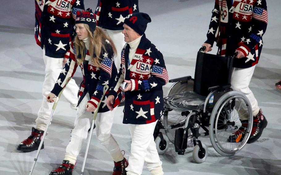 Injured American moguls skier Heidi Kloser uses crutches to enter Fisht Olympic Stadium with the United States team during the Opening Ceremony for the Winter Olympics in Sochi, Russia, Friday, Feb. 7, 2014. (Brian Cassella/Chicago Tribune/MCT)