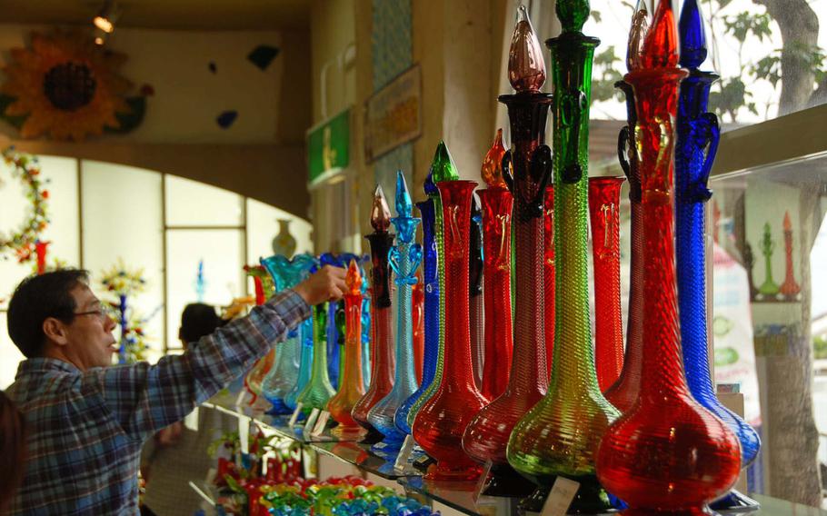 Visitors to Okinawa's largest glass factory can buy a range of glass products from its outlet shop.