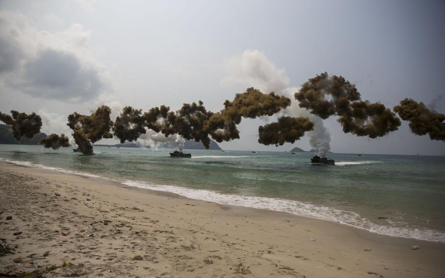Royal Thai, Republic of Korean and U.S. assault amphibious vehicles lay a smoke screen during an amphibious demonstration at Hat Yao Beach, Kingdom of Thailand Feb. 14 during exercise Cobra Gold 2014.