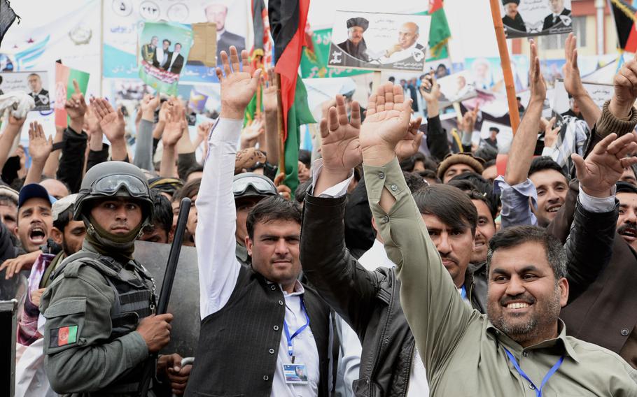 Afghans cheer at a rally for presidential candidate Ashraf Ghani in Kabul on April 1, 2014. Such rallies often attracted thousands in the larger cities, while in rural areas, security fears were expected to keep many would-be voters at home.