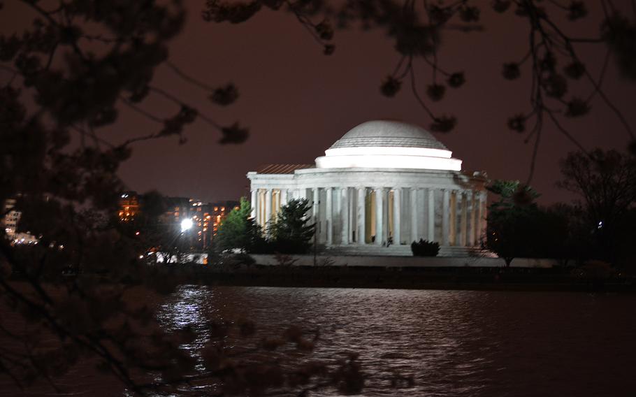 The rainy night on April 12, 2014, cast a red glow on the Tidal Basin in Washington, D.C., on April 12, 2014.