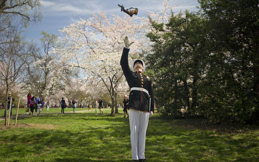 U.S. Marine Corps Pfc. Matthew Evans, a member of the Marine Corps Silent Drill Platoon, practices rifle maneuvers before a performance at the Thomas Jefferson Memorial during the Cherry Blossom Festival in Washington D.C., April 13, 2014.