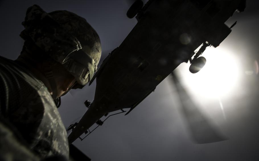 A 4th Infantry Division soldier watches as a UH-60 Black Hawk from the 42nd Combat Aviation Brigade, New York Army National Guard, approaches during training at Camp Buehring, Kuwait, April 19, 2014.

Marcus Fichtl/U.S. Army