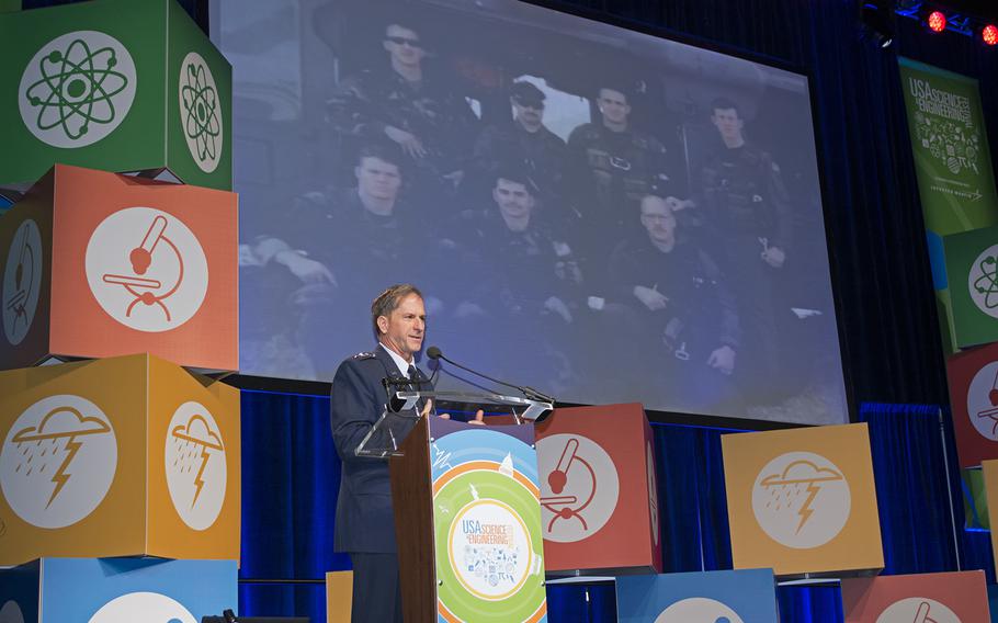 Lt. Gen. David Goldfein of the US Air Force speaks about the importance of science and technology at the USA Science and Engineering Festival on April 25, 2014 in Washington, D.C. Pictured behind him are the medics that saved his life after his plane was shot down over Serbia. 