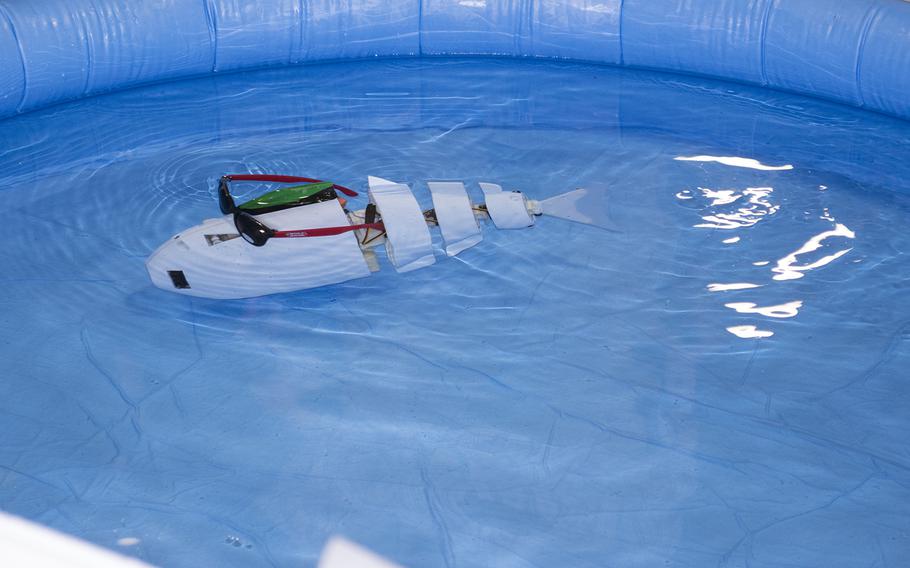 A waterproof robot shows off its abilities in a pool of water at the USA Science and Engineering Festival on April 25, 2014 in Washington, D.C.