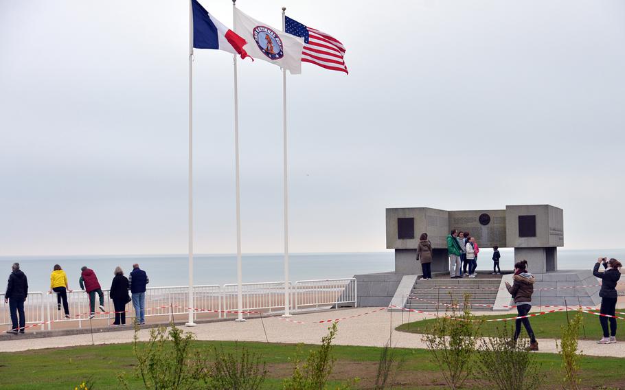 The National Guard Memorial at Vierville-sur-Mer on Omaha Beach stands on a former German gun position. The inscriptions inside the U-shaped monument tell the National Guard's story in English and French.