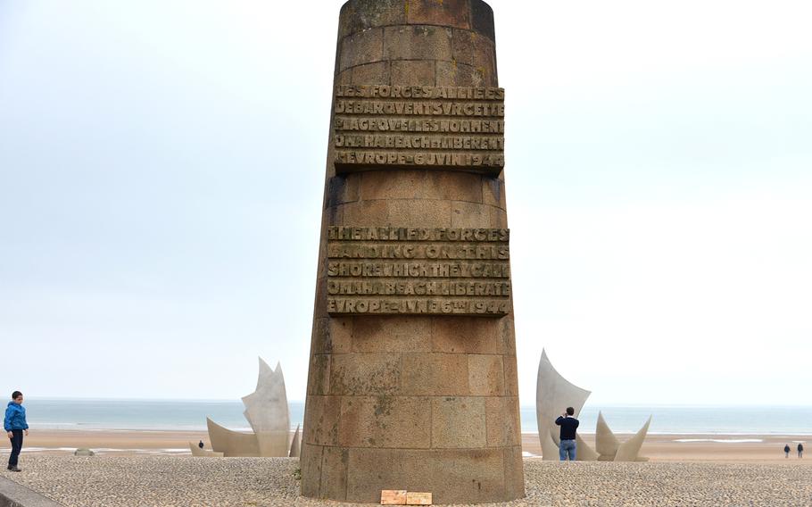 The Signal Monument at Saint-Laurent-sur-Mer on Omaha Beach has a dedication to the 1st Infantry Division on one side and the 116th Infantry Regimental Combat Team on the other. Behind it on the beach is the modern stainless steel sculpture "Les Braves."