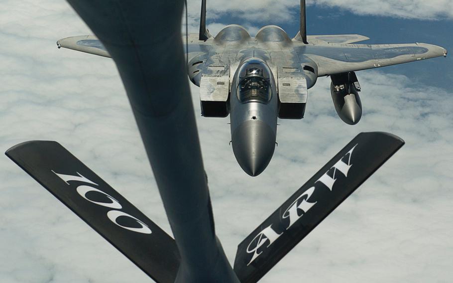 A KC-135 Stratotanker deployed from RAF Mildenhall, England, prepares to refuel an F-15C Eagle deployed from RAF Lakenheath, England, during a training mission near Keflavik International Airport on May 28, 2014.