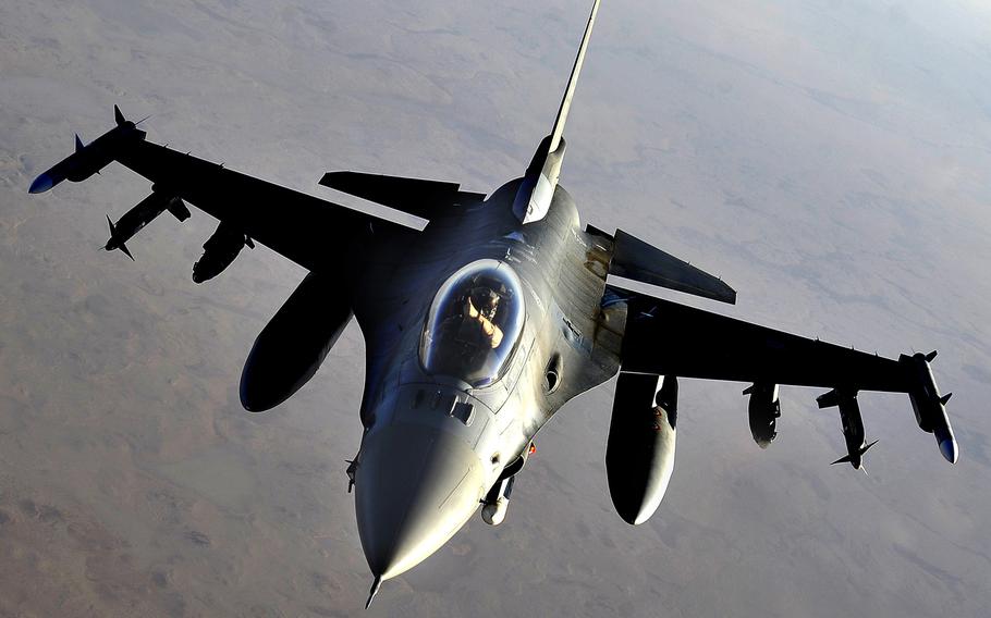 A U.S. Air Force F-16 Fighting Falcon from the 79th Expeditionary Fighter Squadron provides top cover for U.S. forces as they transition personnel and equipment out of Iraq, in this 2011 file photo.