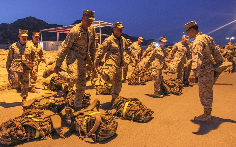 U.S. Marines from Command Element Marine Forces Central Command get up early for a 4 mile hike, with packs, at exercise Eager Lion near Aqaba, Jordan, June 6.