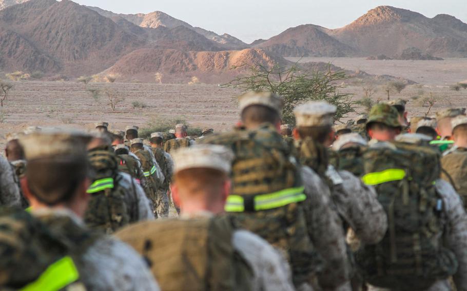 U.S Marines from Command Element Marine Forces Central Command go on an early morning 4 mile hike in a mountainous area near Aqaba, Jordan, June 6.