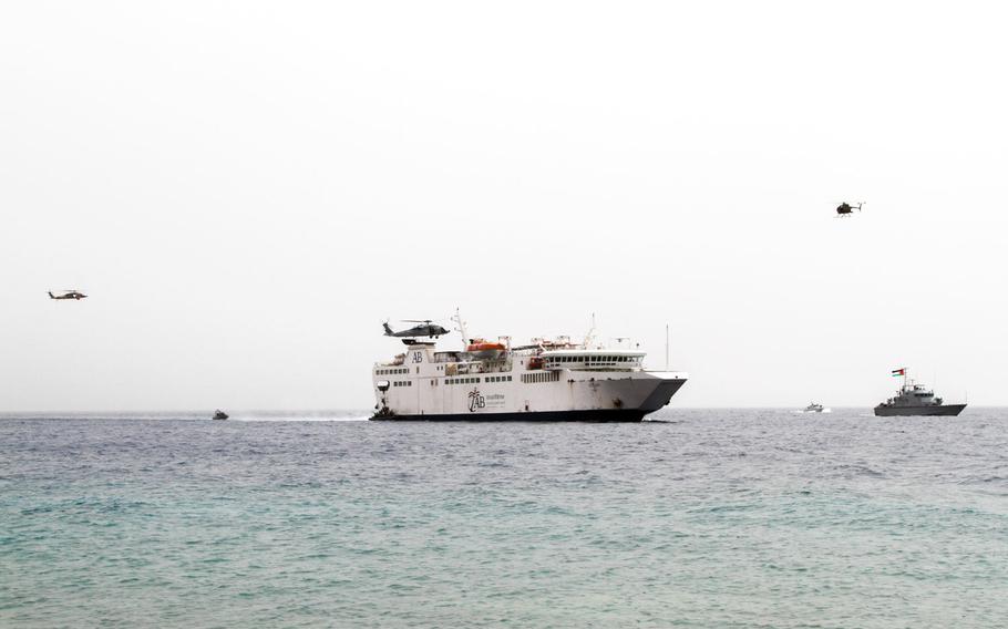 Multinational Special Forces use helicopters, inflatable boats  and patrol craft to demonstrate how they would regain control of a hijacked ferry during a demonstration to the media and civilian observers at Eager Lion in Aqaba, Jordan, June 5.