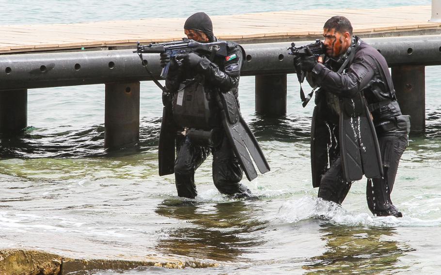 Jordanian Special Forces emerge from the water to conduct a sea-based assault on a target ashore during a demonstration to the media and civilian observers at Eager Lion in Aqaba, Jordan, June 5.