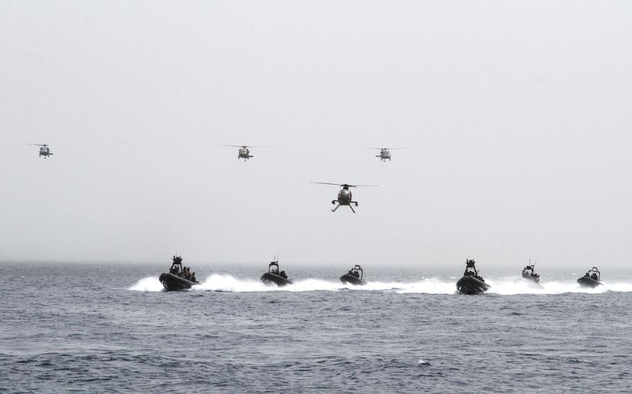 Multinational Special Forces use helicopters and inflatable boats to assault a target ashore during a demonstration to the media and civilian observers at Eager Lion in Aqaba, Jordan, June 5.
