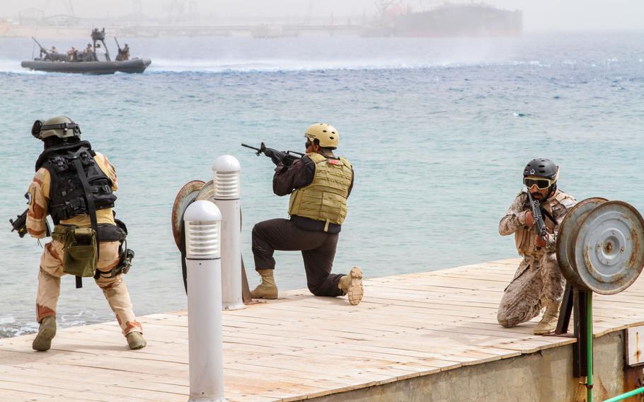Multinational Special Forces make their way back to the inflatable boats after conducting a sea-based assault on a target ashore during a demonstration to the media and civilian observers at Eager Lion in Aqaba, Jordan, June 5.