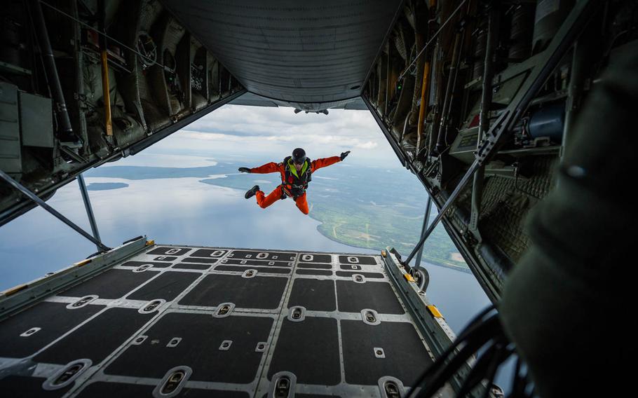 Royal Canadian Air Force Master Cpl. Marc Tremblay, search and rescue technician with the 417 Combat Support Squadron, 4 Wing Canadian Forces Base Cold Lake jumps out of a C-130 Hercules from the 914th Airlift Wing, Niagara Falls Air Reserve Station, New York, during Maple Flag in Edmonton/Cold Lake, Alberta, Canada, on Tuesday, June 3, 2014. 