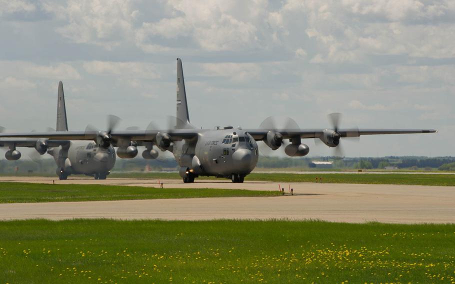 U.S. Air Force C-130 Hercules aircraft taxi during Maple Flag in Edmonton/Cold Lake, Alberta, Canada, on Monday, May 26, 2014. Maple Flag is an international exercise designed to enhance the interoperability of C-130 aircrews, maintainers and support specialists in a simulated combat environment.