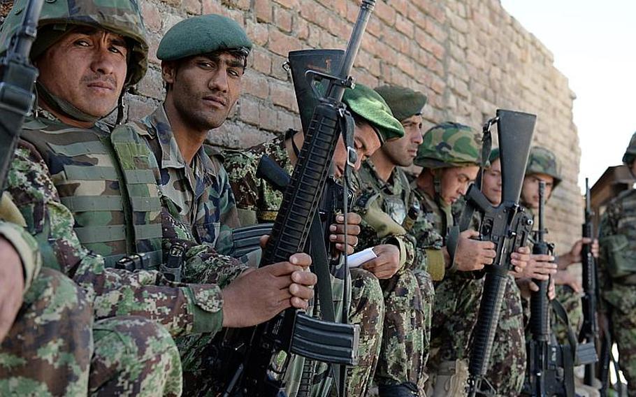 Afghan National Army soldiers stage at a base in Wardak province, Afghanistan as part of efforts to secure the second round of voting in the national presidential election.