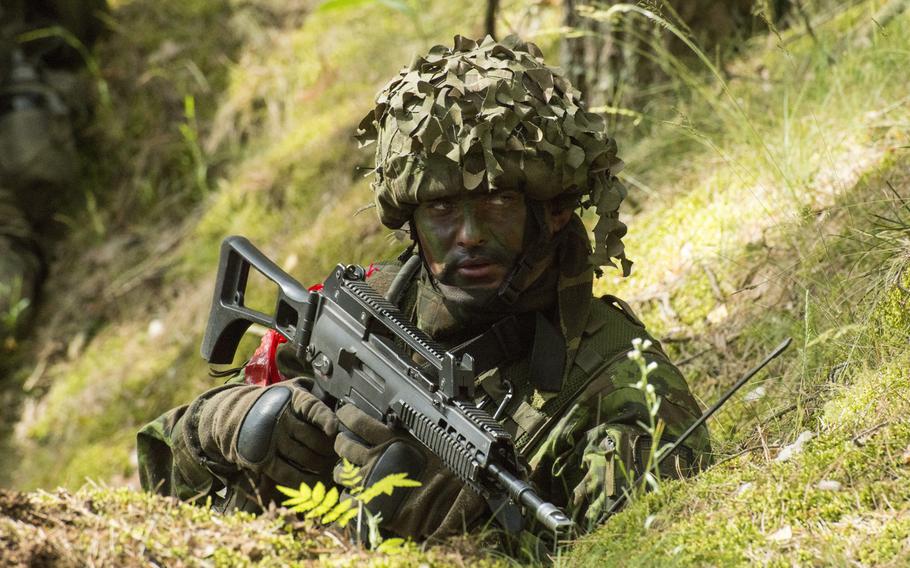 A soldier from the Reaction Battle Group of the 2nd Brigade of the Danish Division holds his position during a multinational field training exercise in cooperation with Saber Strike 2014 on June 16, 2014, at the Gai??iunu Training Range near Rukla.