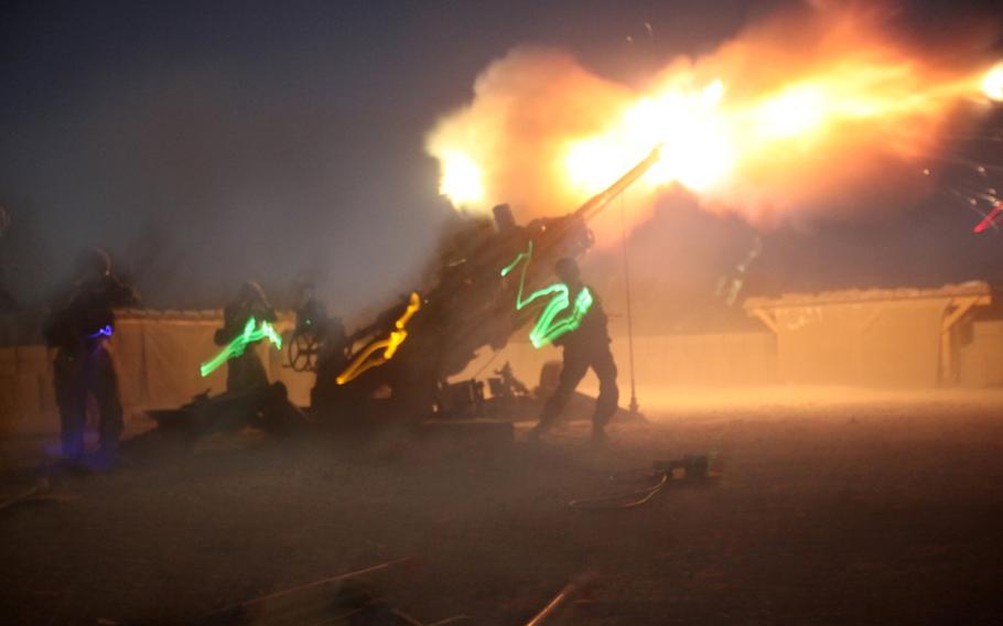 Marines with the 11th Marine Regiment fire their M777A2 Howitzer during a fire mission aboard Camp Bastion, Afghanistan, on June 13, 2014.