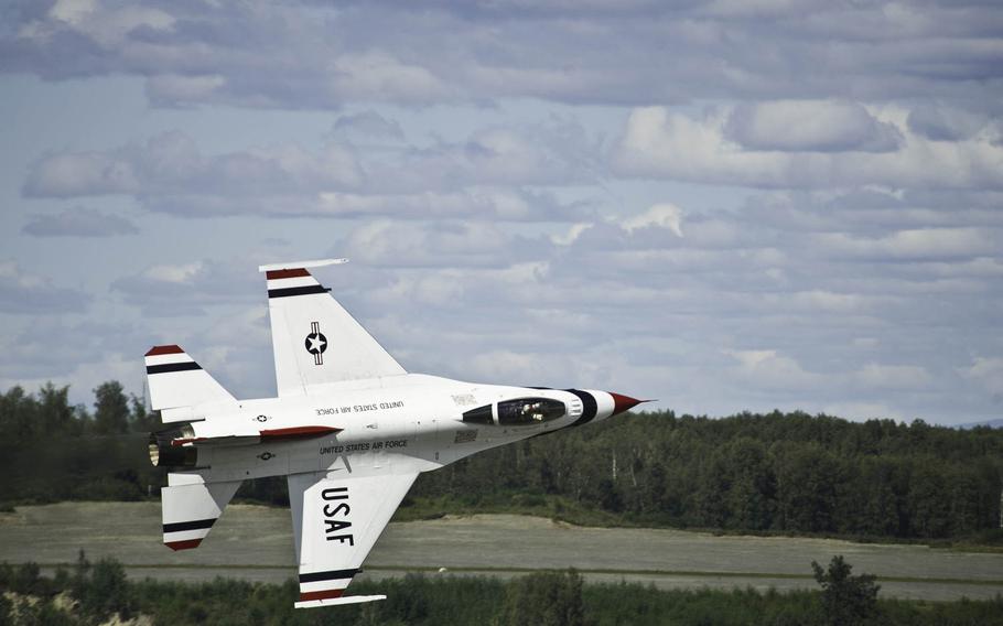 A U.S. Air Force F-16 Fighting Falcon fighter jet with the Thunderbirds performs a low flyby during the Arctic Thunder Open House on Saturday, July 26, 2014. Arctic Thunder Open House is a biennial event hosted by Joint Base Elmendorf-Richardson, Alaska. Featuring more than 40 Air Force, Army and civilian aerial acts, it is the largest two-day event in the state. 

Efren Lopez/U.S. Air Force