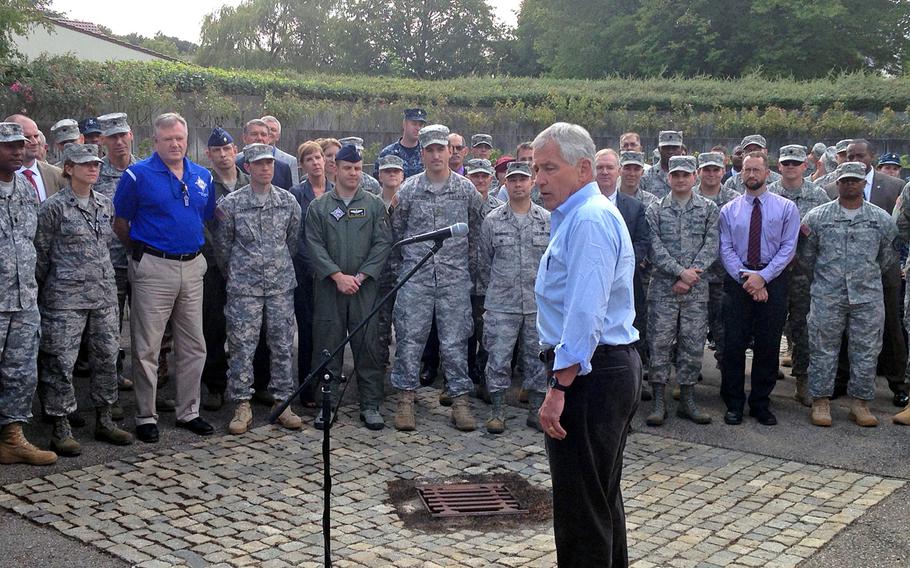 Defense Secretary Chuck Hagel talks with troops during a stop Wednesday,  Aug. 6, 2014 at U.S. European Command headquarters in Stuttgart, where Hagel met with Gen. Philip Breedlove and conducted a brief town hall session with servicemembers.
