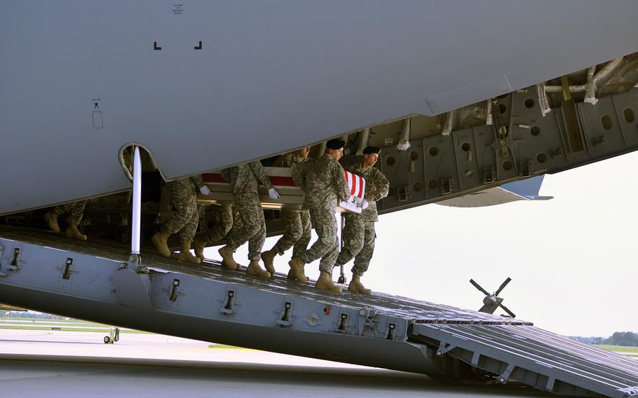 An Army carry team transfers the remains of Army Maj. Gen. Harold Greene, Thursday, Aug. 7, 2014, at Dover Air Force Base, Del.