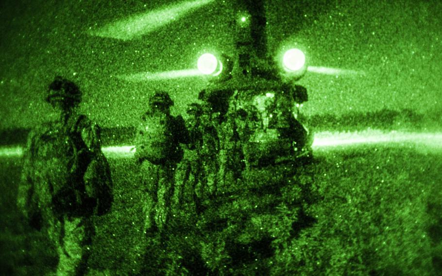 Soldiers with 1st Brigade Combat Team, 101st Airborne Division (Air Assault) file into a CH-47 Chinook helicopter during the joint-forced-entry mission at the Joint Readiness Training Center, Fort Polk, La., on Aug. 14, 2014.