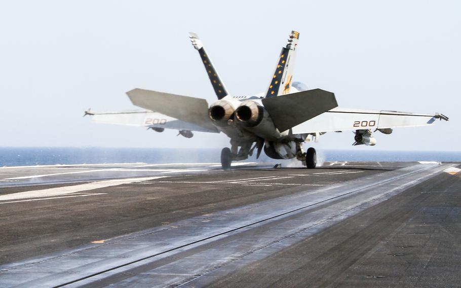 A U.S. Navy F/A-18 Hornet launches from the deck of the USS George H.W. Bush, while underway in the Persian Gulf, Aug. 11, 2014.