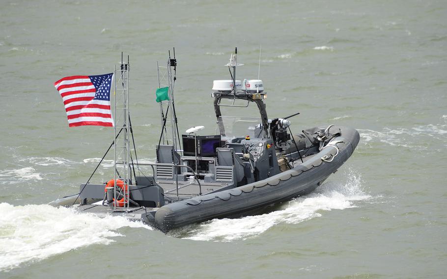 An unmanned 11-meter rigid hulled inflatable boat (RHIB) from Naval Surface Warfare Center Carderock operates autonomously during an Office of Naval Research (ONR)-sponsored demonstration of swarmboat technology held on the James River in Newport News, Va. During the demonstration as many as 13 Navy boats, using an ONR-sponsored system called CARACaS (Control Architecture for Robotic Agent Command Sensing), operated autonomously or by remote control during escort, intercept and engage scenarios.