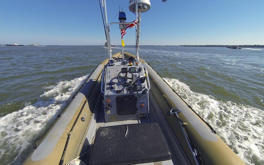 An unmanned seven meter rigid hulled inflatable boat (RHIB) operates autonomously during an Office of Naval Research (ONR)-sponsored demonstration of swarmboat technology held on the James River in Newport News, Va. During the demonstration as many as 13 Navy boats, using an ONR-sponsored system called CARACaS (Control Architecture for Robotic Agent Command Sensing), operated autonomously or by remote control during escort, intercept and engage scenarios.
