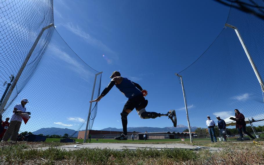 Master Sgt. Chris Aguilera throws the discus during the 2014 Warrior Games on Sept. 30, 2014, in Colorado Springs, Colo.