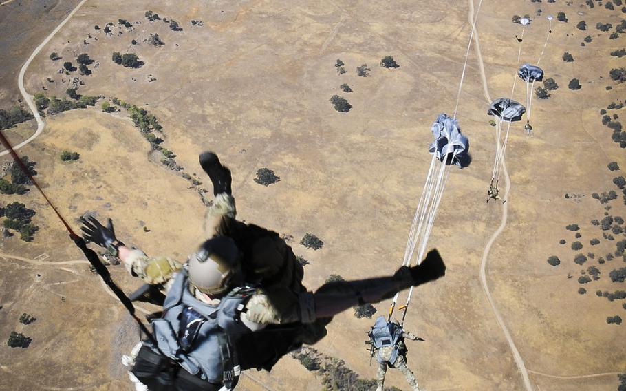 The Guardian Angel Pararescue Team  assigned to the 129th Rescue Wing, conduct a static-line jump over, Fort Hunter Liggett, Calif., on Oct. 2, 2014.