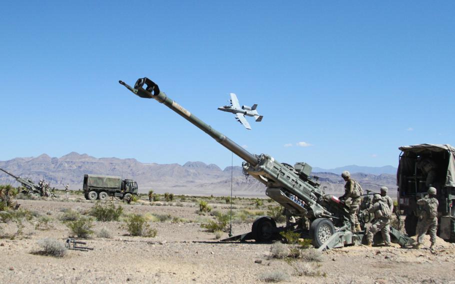Soldiers of 1st Stryker Brigade Combat Team, 4th Infantry Division, provide live artillery support for the U.S. Air Force Weapons School during a joint training mission near Nellis Air Force Base, Nev.