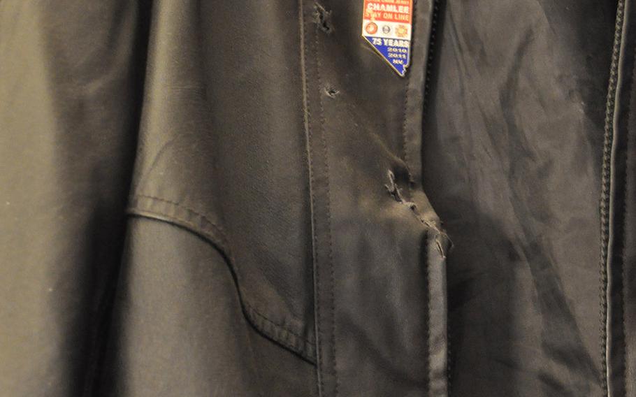 Bullets tore holes in Stanley Gibson's jacket when he was gunned down by a Las Vegas police officer on Dec. 12, 2011. The jacket hangs in the home of his widow, Rondha Gibson. A Gulf War veteran who struggled with PTSD, Stanley Gibson was unarmed when he was killed.