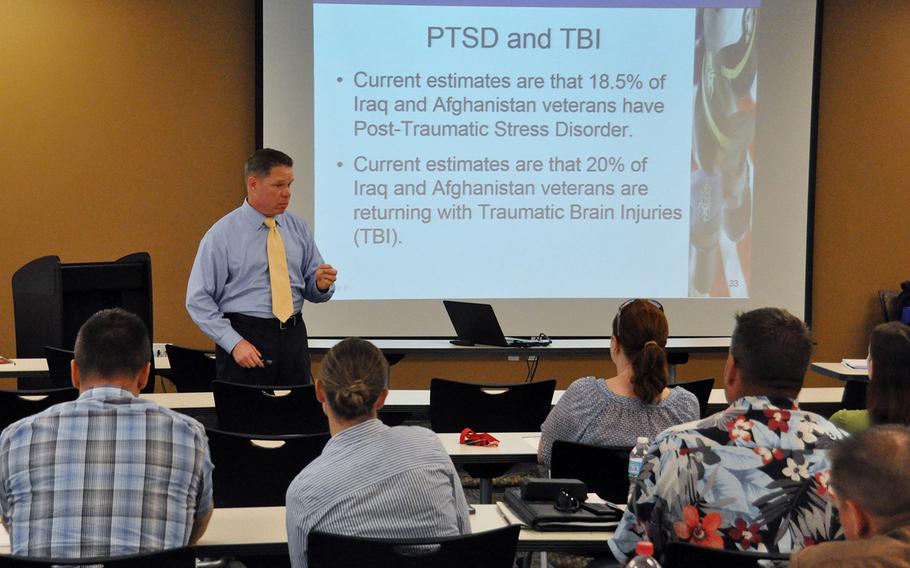 John Baker, an instructor with the Upper Midwest Community Policing Institute, addresses a group of Las Vegas law enforcement personnel during a training course for de-escalation tactics in handling veterans in crisis. In 2011, a Las Vegas police officer fatally shot Stanley Gibson, a Gulf War veteran with PTSD who was unarmed at the time.
