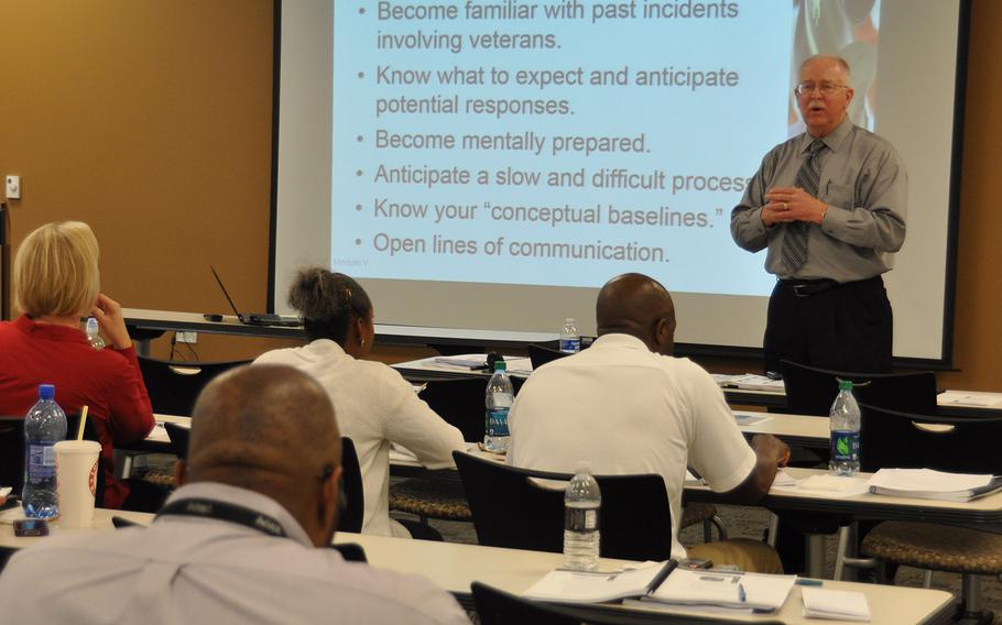 Bill Micklus, an instructor with the Upper Midwest Community Policing Institute, addresses a group of Las Vegas law enforcement personnel during a training course for de-escalation tactics in handling veterans in crisis. In 2011, a Las Vegas police officer fatally shot Stanley Gibson, a Gulf War veteran with PTSD who was unarmed at the time.