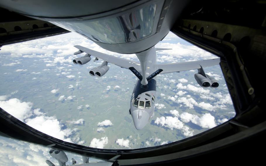 A B-52 Stratofortress refuels through the boom of a KC-135 Stratotanker over Britain on June 11, 2014. The Stratofortress was in Britain to help familiarize the bomber's aircrew with flying in Europe.